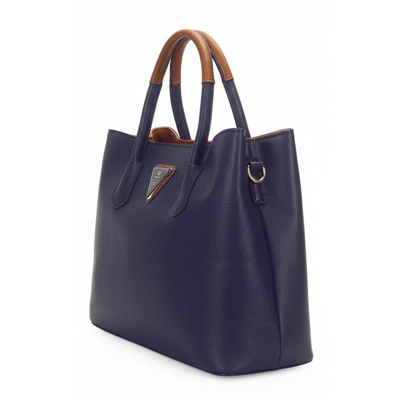 Bolsa feminina azul marinho vista lateral com alças caramelo e detalhe triangular frontal da marca WJ